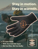 Pair of black Aerynx winter gloves on a flat surface, showcasing the three-finger touchscreen capability and silicone palm gr