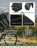 Pair of black Aerynx winter gloves on a flat surface, showcasing the three-finger touchscreen capability and silicone palm gr