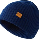 Close-up of a knitted FUQILA Merino wool cuff beanie hat in a solid color, showcasing its soft texture.