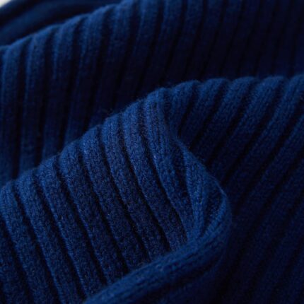 Close-up of a knitted FUQILA Merino wool cuff beanie hat in a solid color, showcasing its soft texture.