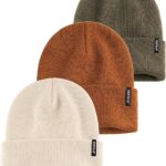 Three cuffed knit beanies in green, caramel, and beige, stacked on a white background, showcasing their soft texture.