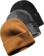 Three cuffed knit beanies in green, caramel, and beige, stacked on a white background, showcasing their soft texture.