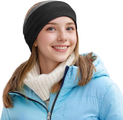 A woman wearing a Sukeen Double-Layer Ear Warmer Headband in Black Gray, smiling while outdoors in winter.